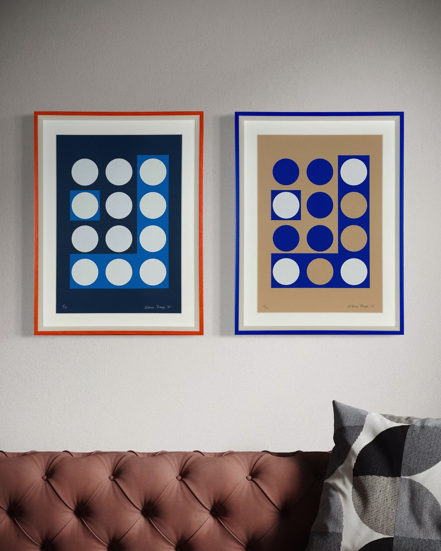 Two framed abstract prints displayed together in a contemporary room