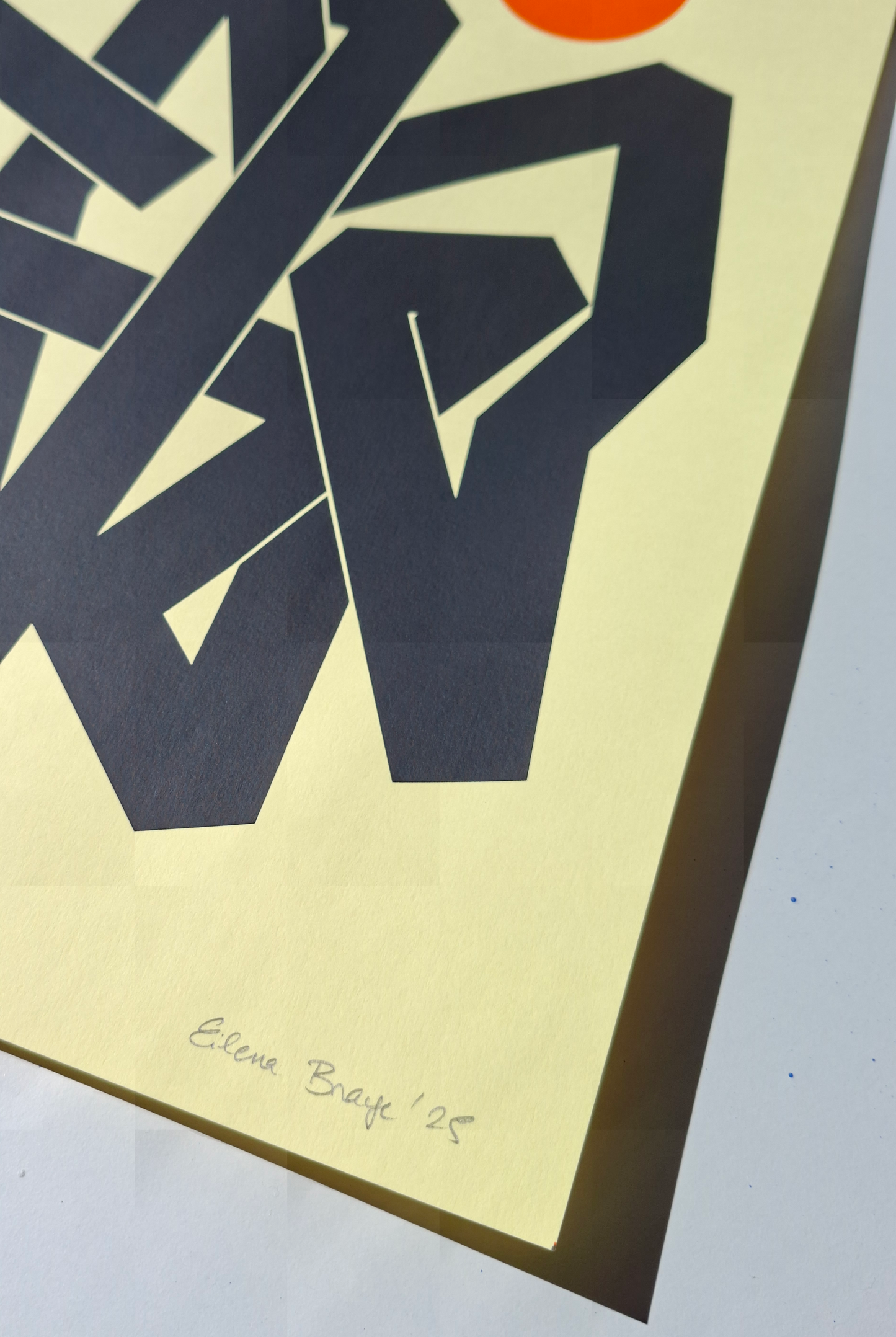 Close-up of Invisible Currents Yellow by Eilena Braye — artist signature and edition number, vibrant yellow ink detail.